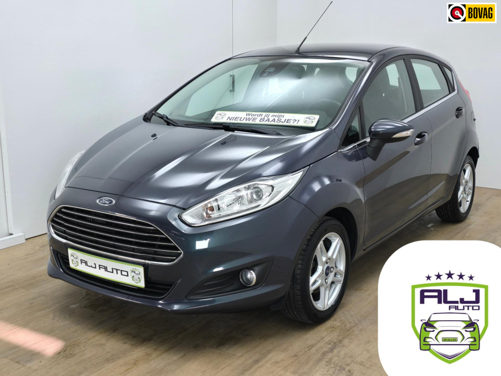 Ford Fiesta occasion in titanium uitvoering met voorruitverwarming (!) | tweedehands ford fiesta in antracietgrijs | cruisecontrol