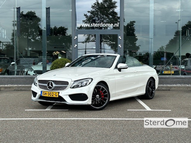 Mercedes-Benz C-Klasse cabrio 180 ambition amg l aircap l led l leder twin l stoelverwarming l camera l designo diamant wit metallic l alarm 3 l pts l bluetooth audio l navigatie l airconditioning l in nieuwstaat l