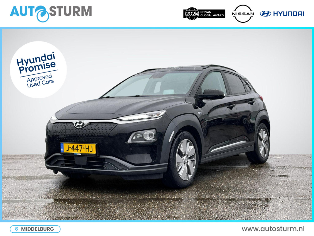 Hyundai Kona ev premium 64 kwh | schuif-/kanteldak | trekhaak | leder | stuur- + stoelverwarming | head-up display | rijklaarprijs!